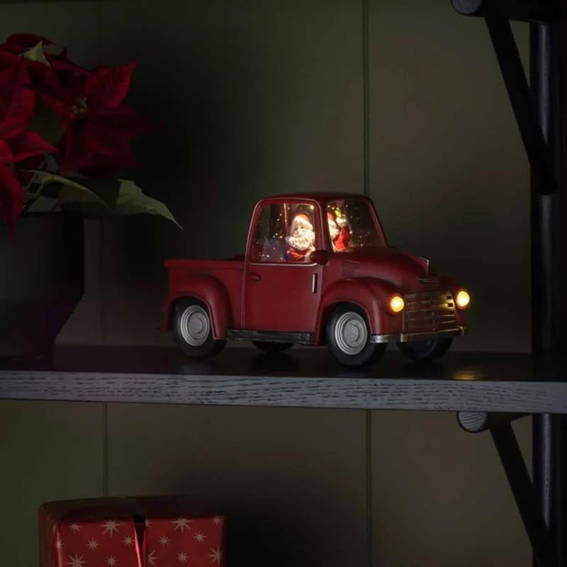 LED Dekoleuchte Pick-up mit Weihnachtsmann batteriebetrieben Rot auf Regal, leuchtende Scheinwerfer und Innenbeleuchtung