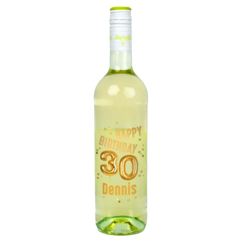 Weißweinflasche mit personalisiertem Etikett „Happy Birthday 30 Dennis“ in goldener Ballon-Schrift und Konfetti-Design