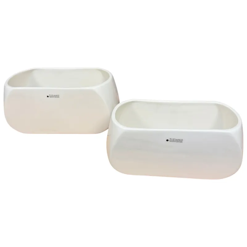 Zwei rechteckige Tiziano Keramikschalen in Cremeweiß in unterschiedlichen Größen vor weißem Hintergrund.